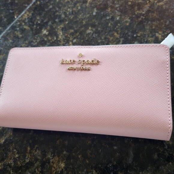 NWOT Kate Spade Pink Wallet measures 6 3/4in by 3 3/4 in - Picture 1 of 3